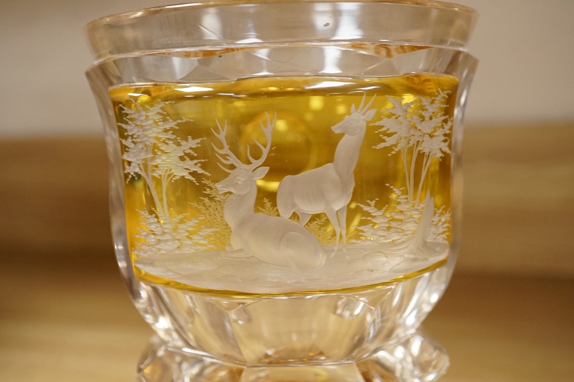 A heavy Bohemian amber flashed glass goblet, late 19th century, decorated with deer, 17cm high